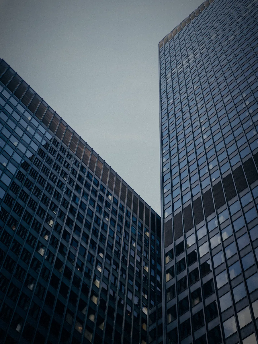 Glass office towers seen from below